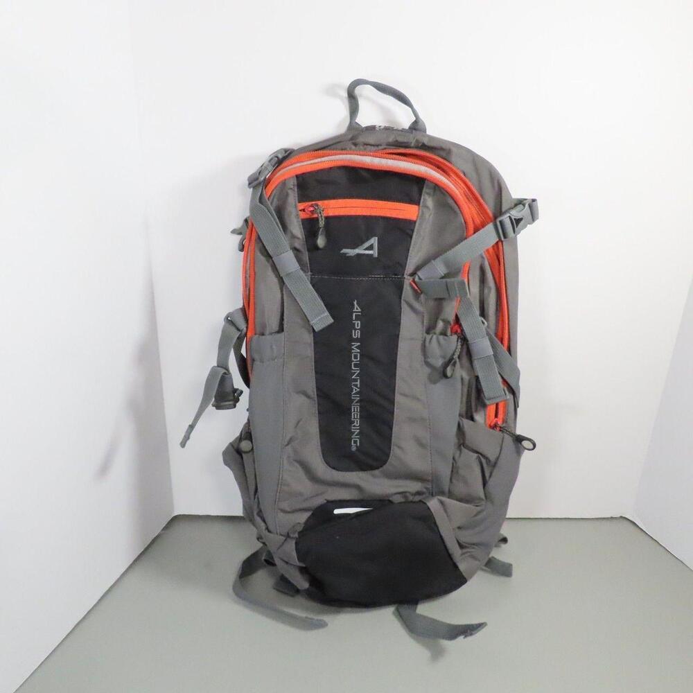 The ALPS Mountaineering Hydro Trail 15 Hydration Backpack in Gray Orange is a du